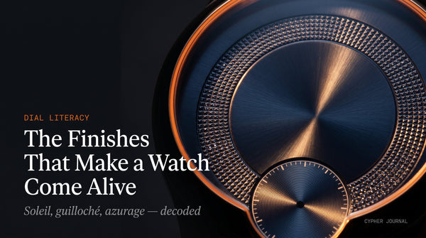 Watch dial finishes explained — macro of a navy soleil sunburst dial with a Clous de Paris guilloché chapter ring and azurage sub-dial catching the light