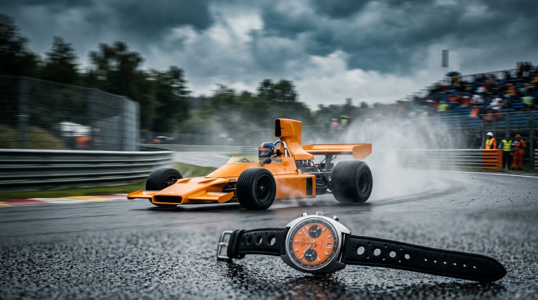 McLaren M23 1974 race car in papaya orange livery racing in the rain — the car that inspired the Cypher Paddock 74 chronograph
